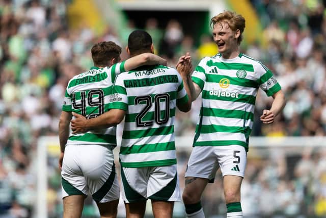 Cameron Carter-Vickers is mobbed by his Celtic teammates after scoring a stunning strike against Kilmarnock.
