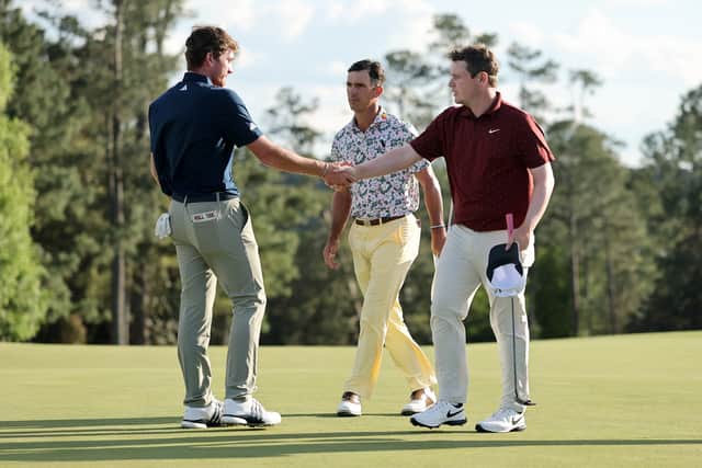 Bob MacIntyre shakes hands with Nick Dunlap at the end of the second round of the 89th Masters at Augusta National, where Billy Horschel was the third player in the group 