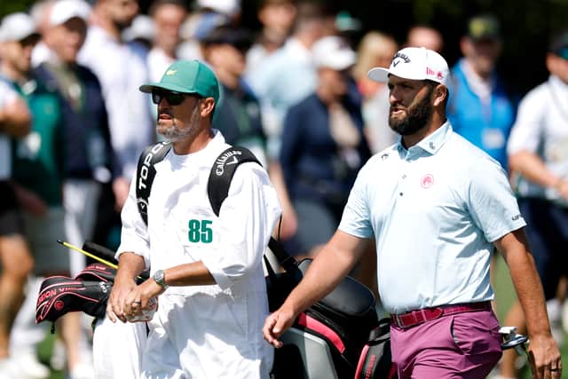 Jon Rahm walks with his caddie Adam Hayes during the third round of the 2025 Masters Tournament at Augusta National Golf Club