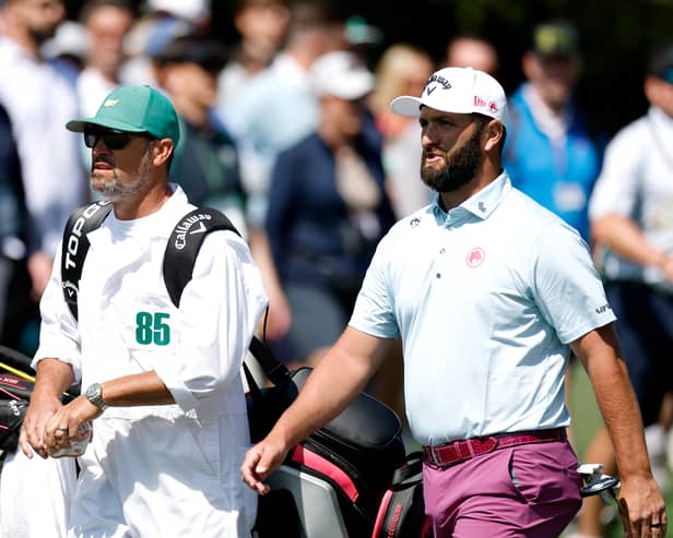Jon Rahm walks with his caddie Adam Hayes during the third round of the 2025 Masters Tournament at Augusta National Golf Club