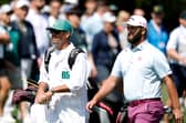 Jon Rahm walks with his caddie Adam Hayes during the third round of the 2025 Masters Tournament at Augusta National Golf Club