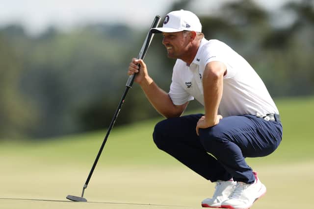 Bryson DeChambeau lines up a putt during the third round of the Masters Tournament 