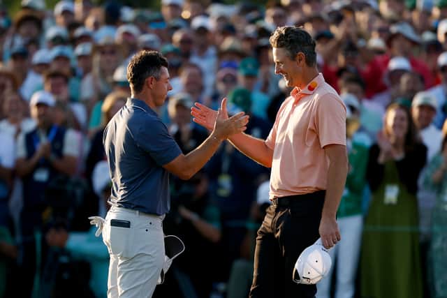 Rory McIlroy shakes hands with Justin Rose after the  play-off at Augusta National Golf Club 