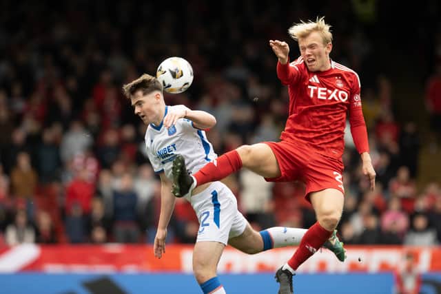 Alexander Jensen challenges Rangers' Findlay Curtis during Aberdeen's 2-2 draw.