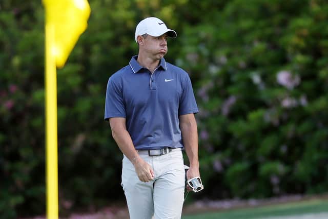 Rory McIlroy reacts on the 13th green after running up a double-bogey 7 in the final round 