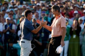 Rory McIlroy and Justin Rose shake hands after their play-off in the 89th Masters 