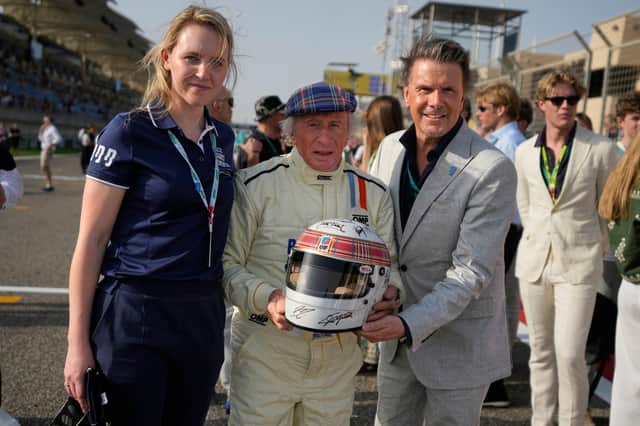 Former Formula One champion Jackie Stewart drives his original car before the Formula One Bahrain Grand Prix