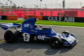Former Formula One champion Jackie Stewart drives his original car before the Formula One Bahrain Grand Prix