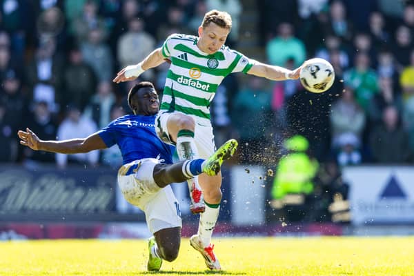 Celtic's Alistair Johnston (R) and St Johnstone's Benjamin Kimpioka in action during St Johnstone's 1-0 win over Celtic at McDiarmid Park earlier this month. Cr: SNS Group.