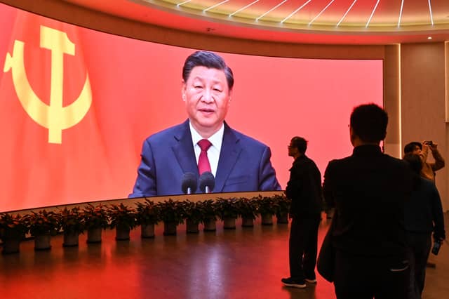 China's President Xi Jinping looms large over visitors to the Museum of the First National Congress of the Chinese Communist Party in Shanghai (Picture: Hector Retamal)