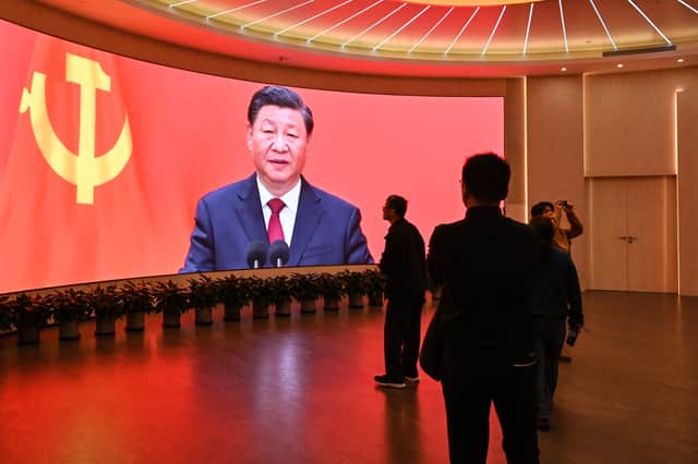 China's President Xi Jinping looms large over visitors to the Museum of the First National Congress of the Chinese Communist Party in Shanghai (Picture: Hector Retamal)