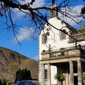 The Rolls-Royce Ghost Series II in an appropriate setting outside Prestonfield House