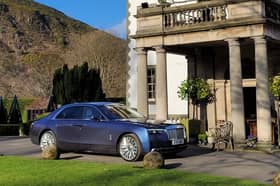 The Rolls-Royce Ghost Series II in an appropriate setting outside Prestonfield House