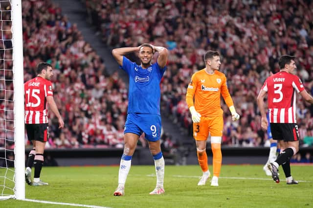 Rangers striker Cyriel Dessers holds his head in disbelief.