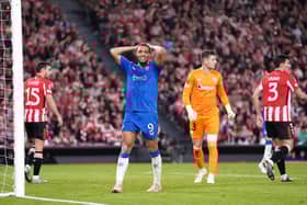 Rangers striker Cyriel Dessers holds his head in disbelief.