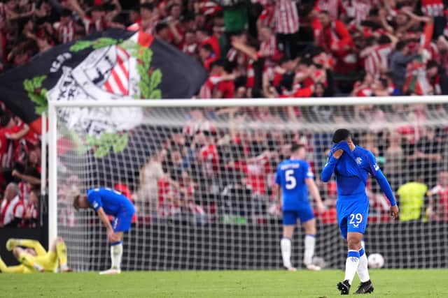 The Rangers players are floored by defeat in Bilbao.
