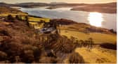 Kingsburgh House overlooking Loch Snizort on Skye. The house can be seen nestled in the trees in the foreground. PIC: Savills.