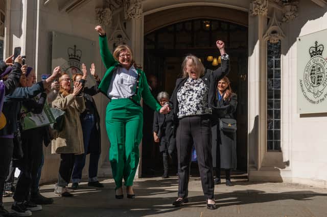 Susan Smith, left, and Marion Calder, directors of campaign group For Women Scotland cheer after the Supreme Court ruled "the terms 'woman' and 'sex' in the Equality Act 2010 refer to a biological woman and biological sex" (Picture: Dan Kitwood)