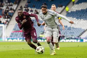 Hearts midfielder Beni Baningime tries to shut down Oday Dabbagh during the Scottish Cup defeat by Aberdeen.