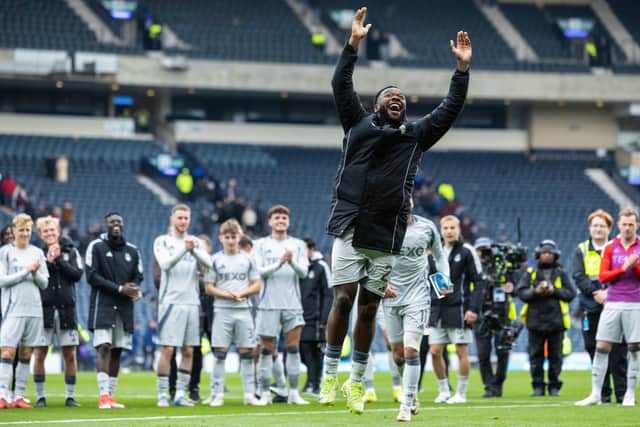 Shayden Morris leads the Aberdeen celebrations at Hampden.