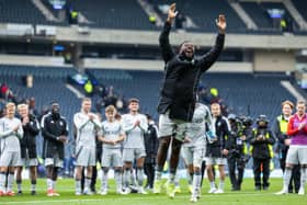 Shayden Morris leads the Aberdeen celebrations at Hampden.