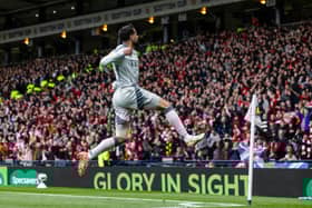 Oday Dabbagh celebrates in front of the gleeful Aberdeen fans after scoring the winning goal against Aberdeen.