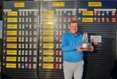 Host club member Andrew Davidson shows off the Battle Trophy after his win in the Crail Golfing Society event