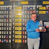 Host club member Andrew Davidson shows off the Battle Trophy after his win in the Crail Golfing Society event