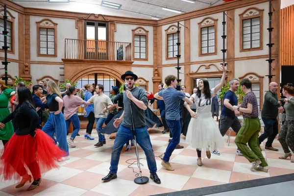 William Morgan (Camille de Rosillon) and the cast of The Merry Widow in rehearsals