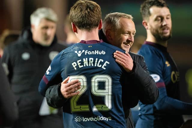James Penrice and Hearts head coach Neil Critchley.