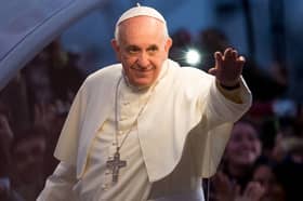 Pope Francis waves to the crowd on his way to World Youth Day celebrations in Rio de Janeiro, Brazil, in 2013 (Picture: Buda Mendes)