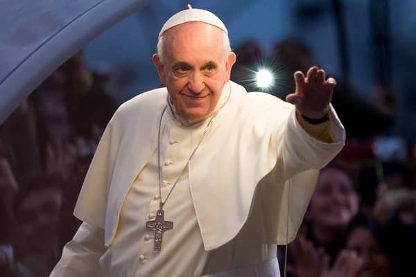 Pope Francis waves to the crowd on his way to World Youth Day celebrations in Rio de Janeiro, Brazil, in 2013 (Picture: Buda Mendes)