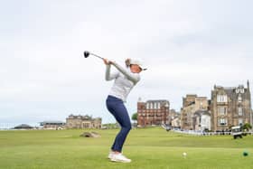 A golfer tees off on the 18th on the Old Course, where a few lucky people will be playing for just £42.50 this year
