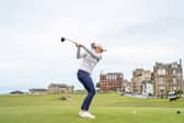 A golfer tees off on the 18th on the Old Course, where a few lucky people will be playing for just £42.50 this year