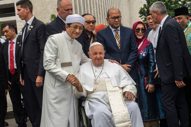 Pope Francis and Grand Imam Nasaruddin Umar shake hands outside the Istiqlal Mosque in Jakarta, Indonesia, in September (Picture: Oscar Siagian)