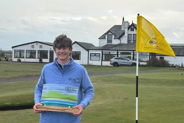 Baberton’s Luca Smith with the SGF Classic trophy after his win at Goswick Links in Northumberland