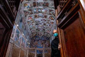 Father Bruno Silvestrini, Custodian of the Apostolic sacred sites, closes the door of the Sistine Chapel. Picture: Andrew Harnik/AFP via Getty Images