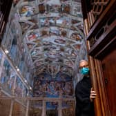 Father Bruno Silvestrini, Custodian of the Apostolic sacred sites, closes the door of the Sistine Chapel. Picture: Andrew Harnik/AFP via Getty Images
