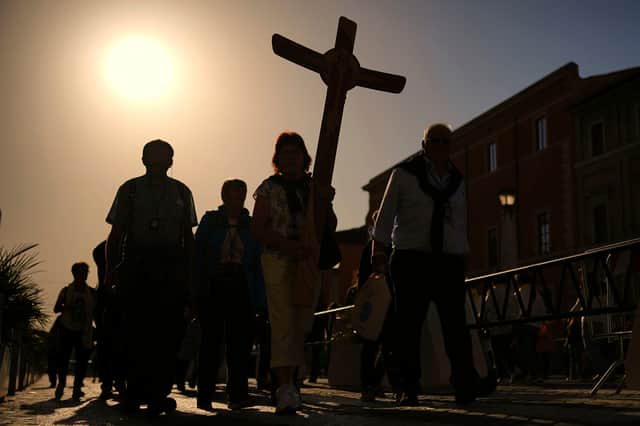 Pilgrims arrive in St Peter's Square at the Vatican on Tuesday
