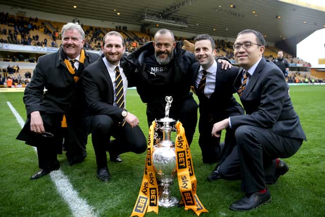 Wolverhampton Wanderers' Managing Director Laurie Dalrymple (second right), Executive Chairman Jeff Shi (right), Sporting Director Kevin Thelwell (second left), Director John Gough (left) and Wolverhampton Wanderers manager Nuno Espirito Santo (centre) celebrate with the trophy after winning the Sky Bet Championship.