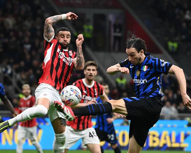 Inter Milan's Matteo Darmian (right) is blocked by AC Milan's Kyle Walker during the Coppa Italia semi-final first leg. (Photo by ISABELLA BONOTTO/AFP via Getty Images)          