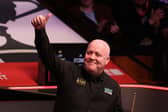 John Higgins will get his second round match underway today.
