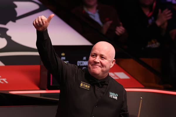 John Higgins will get his second round match underway today.
