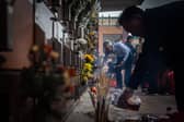 People place offerings on the graves of their ancestors during the annual Qingming festival, or Tomb Sweeping Day, at the United Chinese Cemetery in Macau on 4 April 2025.