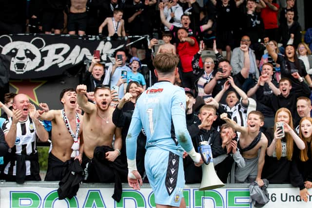 St Mirren's Zach Hemming celebrates with fans at full-time after securing a top six spot against Ross County.