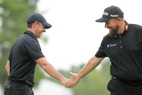 Rory McIlroy and Shane Lowry interact during the first round of the Zurich Classic of New Orleans in Avondale, Louisiana