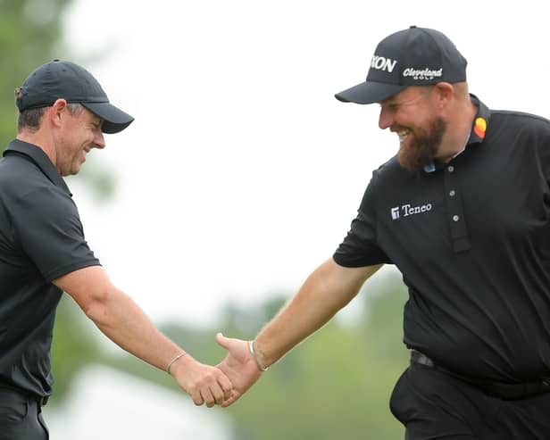 Rory McIlroy and Shane Lowry interact during the first round of the Zurich Classic of New Orleans in Avondale, Louisiana