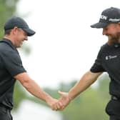 Rory McIlroy and Shane Lowry interact during the first round of the Zurich Classic of New Orleans in Avondale, Louisiana