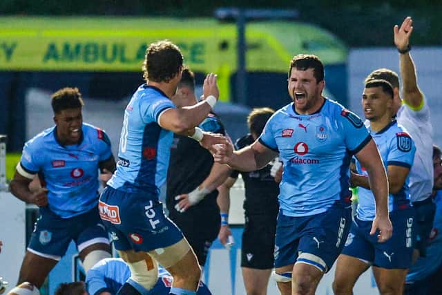 Bulls' Marco van Standen (R) celebrates after Johan Goosen scores a second half try. (Photo by Calum Chittleburgh / SNS Group)