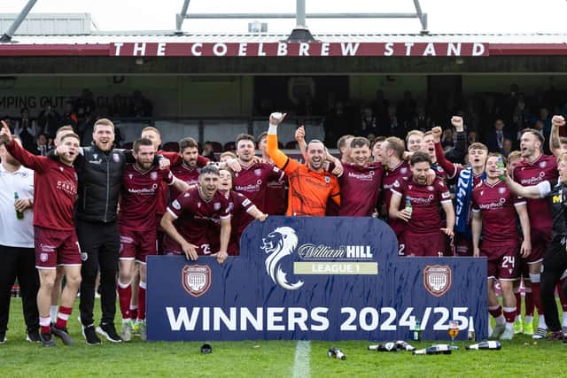 Arbroath players and staff celebrate winning the William Hill League One title two weeks ago. (Photo by Ross Parker / SNS Group)â¨